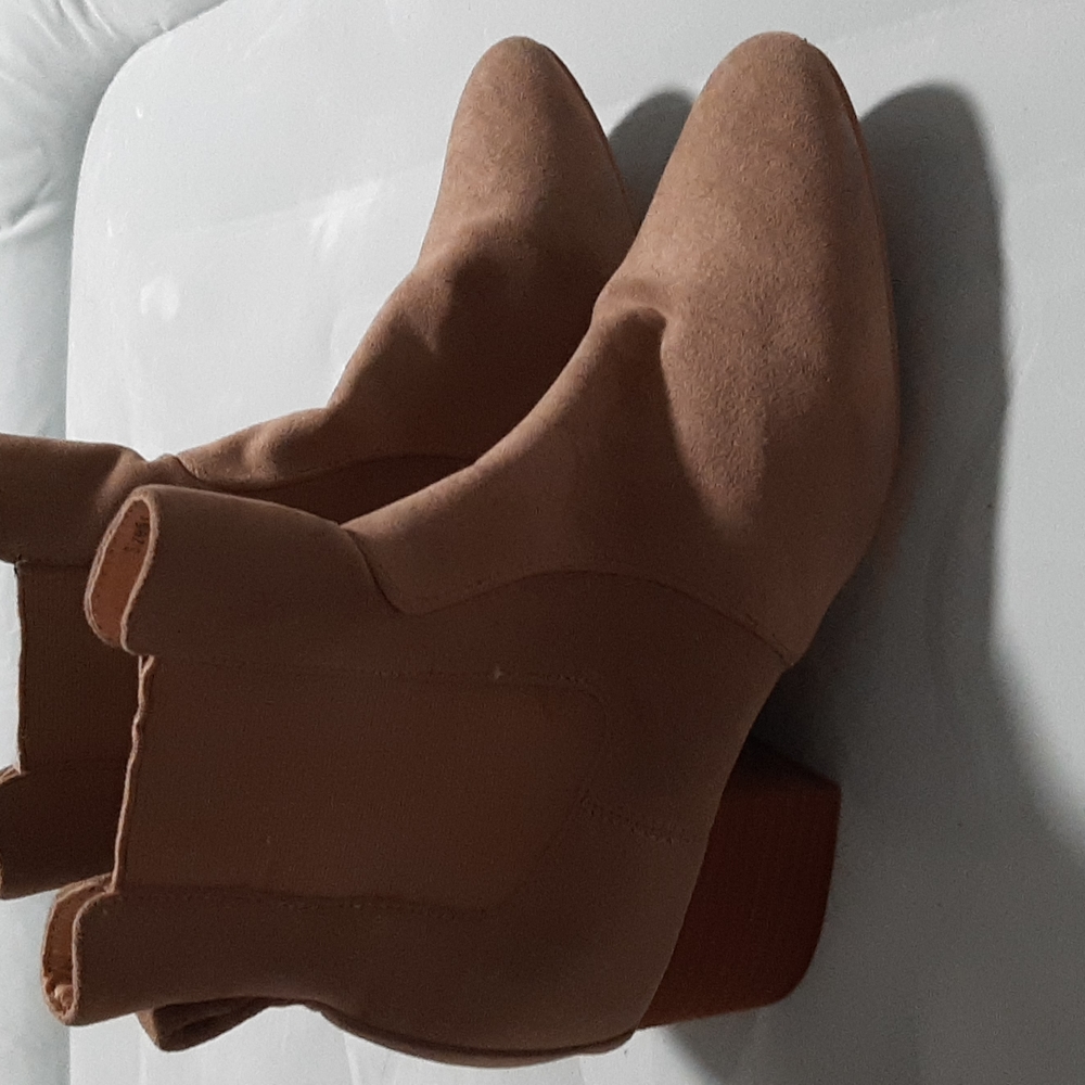 Wedge high heeled boots.
